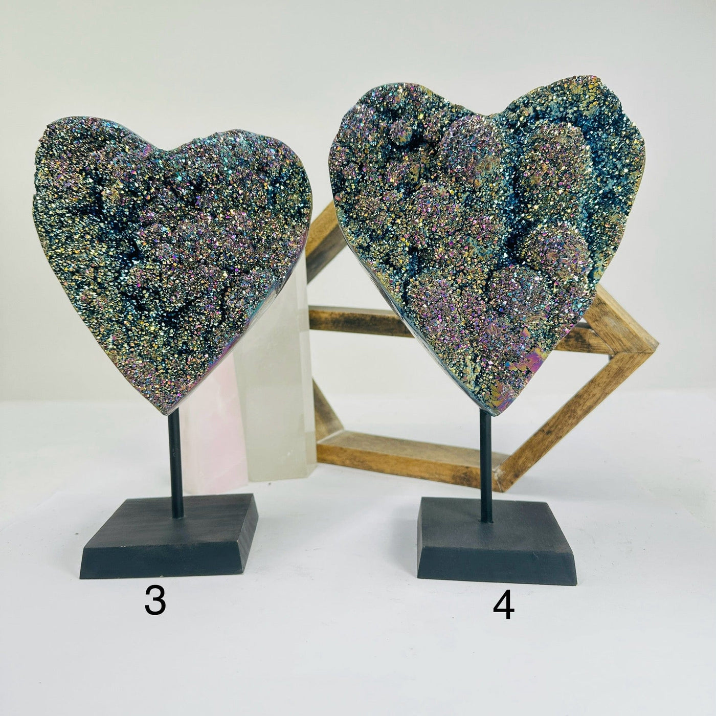 titanium coated heart on stand with decorations in the background