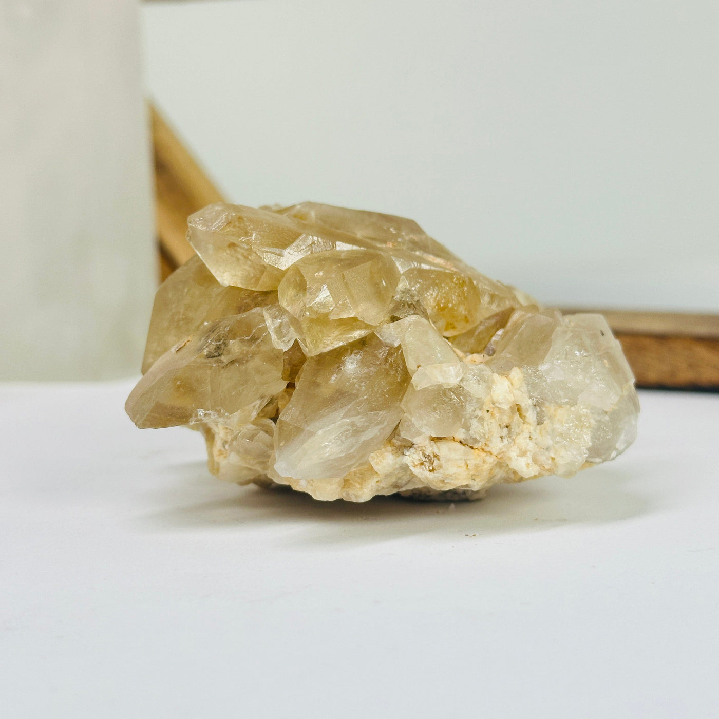 citrine cluster with decorations in the background