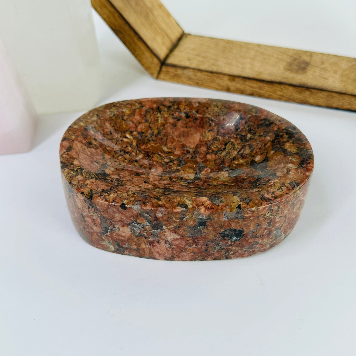 feldspar and tourmaline bowl with decorations in the background