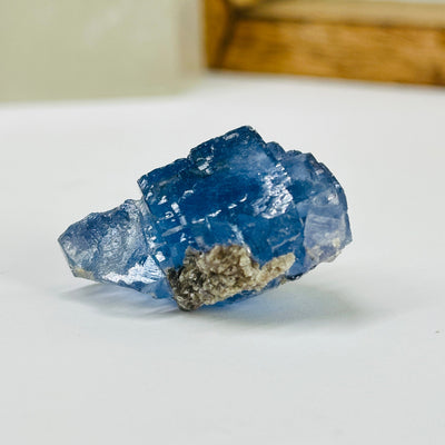 blue fluorite with decorations in the background