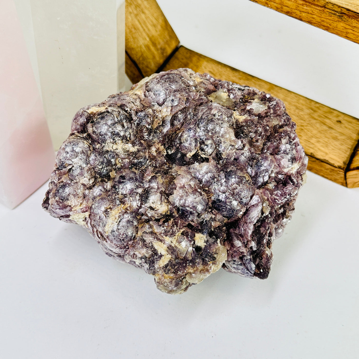 lepidolite with decorations in the background