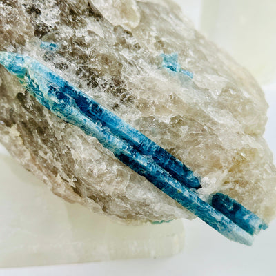  Aquamarine in matrix - aquamarine crystal diagonally embedded in natural rough stone close up for detail