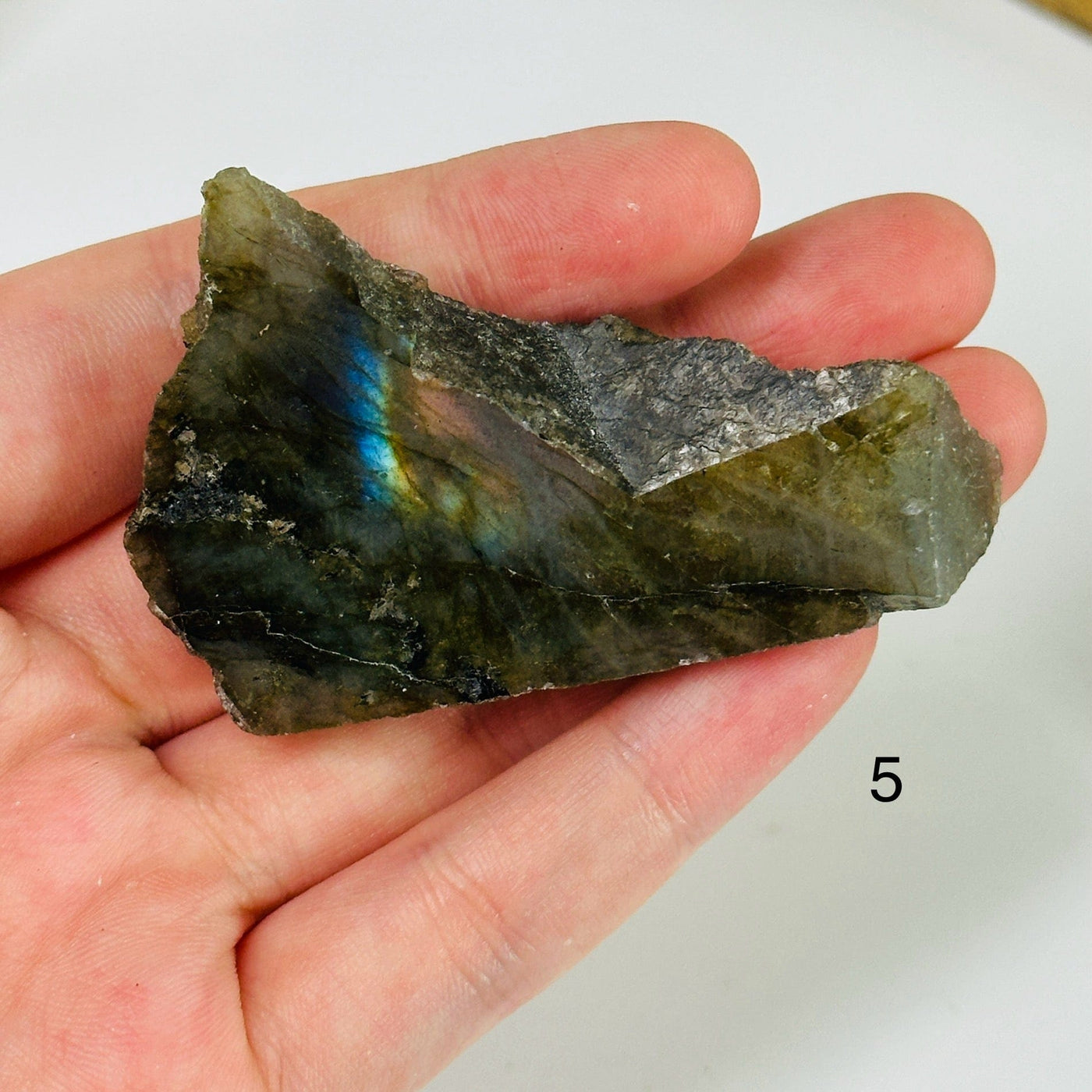 labradorite with decorations in the background