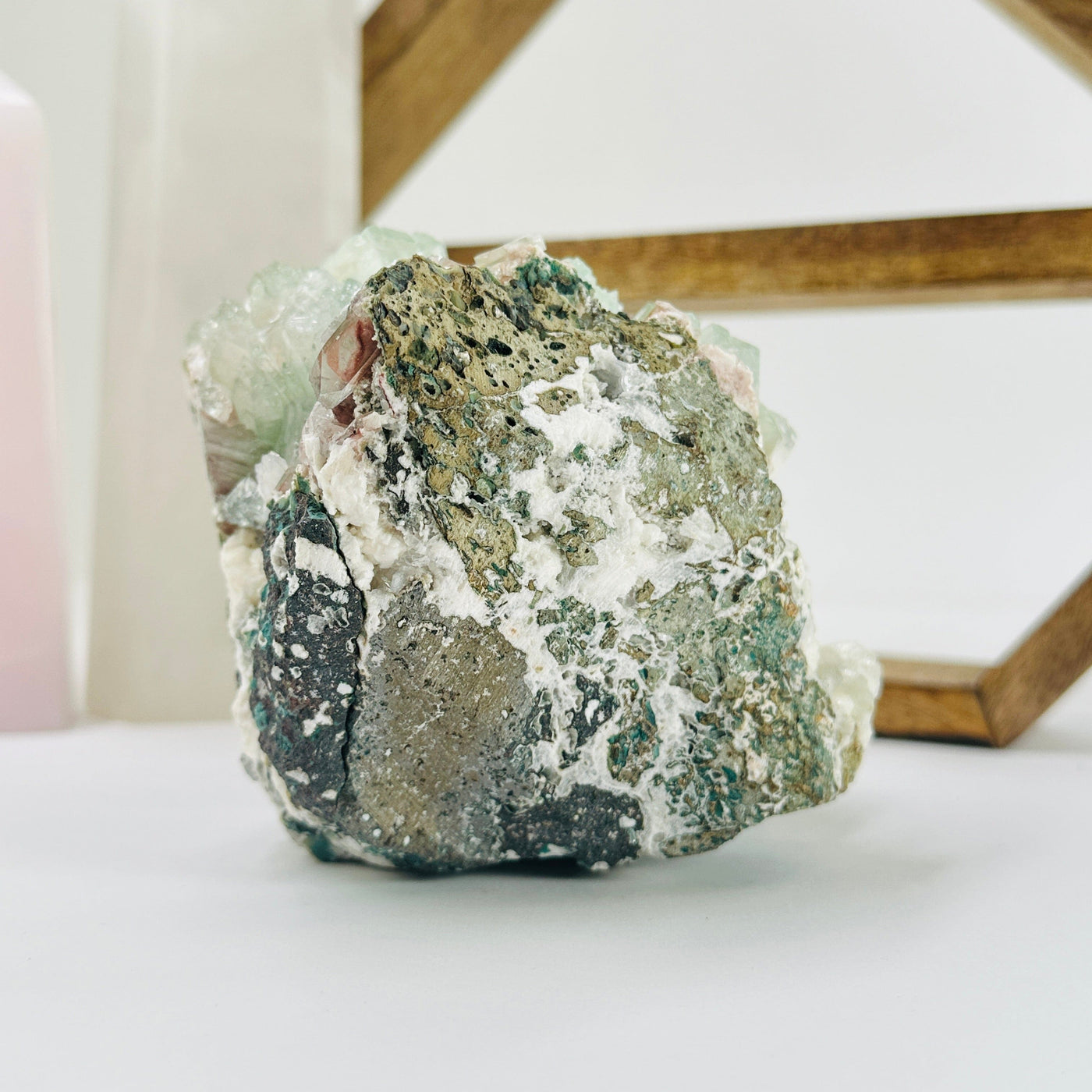 apophyllite with decorations in the background