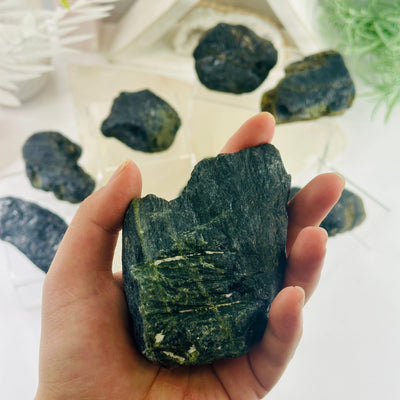 Green Tourmaline - Rough Stone - You Choose variant 9 in hand for size reference with other variants in background