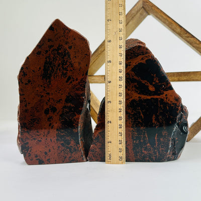 mahogany obsidian cut base with decorations in the background