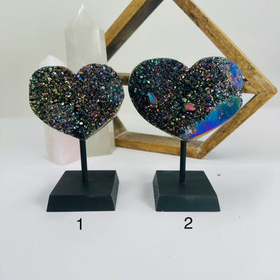titanium coated heart on stand with decorations in the background