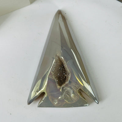 agate arrowhead with decorations in the background
