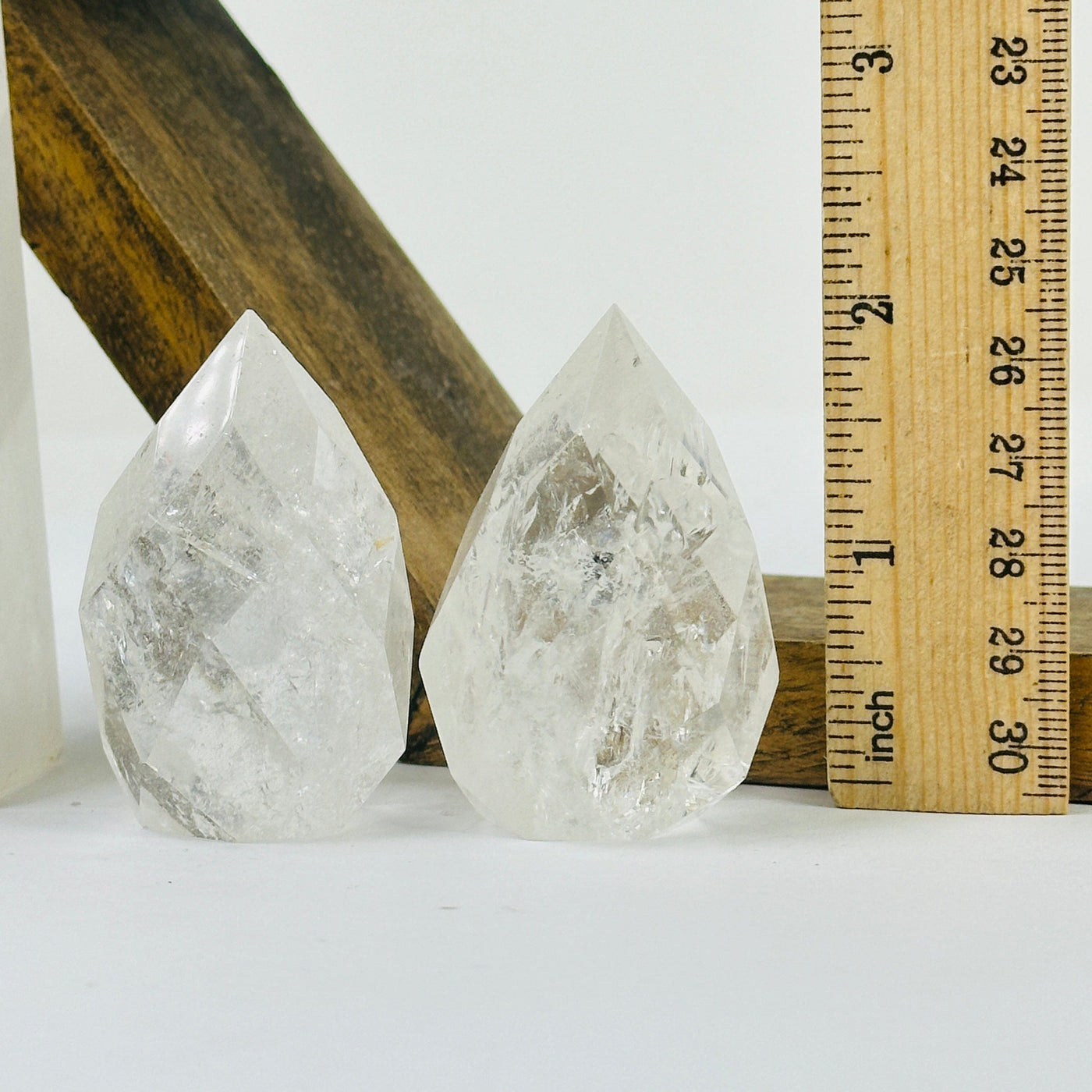 crystal quartz point with decorations in the background