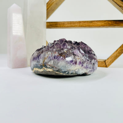 amethyst heart with decorations in the background