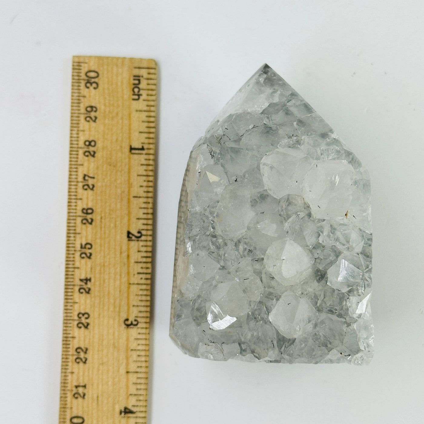 amethyst POINT next to a ruler for size reference