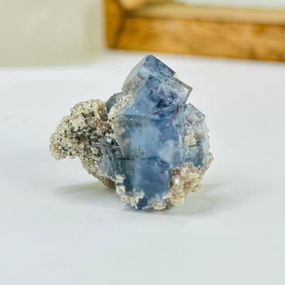 blue fluorite with decorations in the background