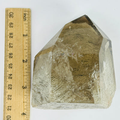 lodalite point next to a ruler for size reference