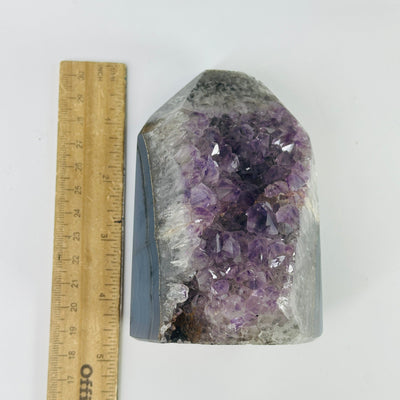 amethyst agate point next to a ruler for size reference