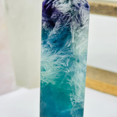 fluorite points with decorations in the background