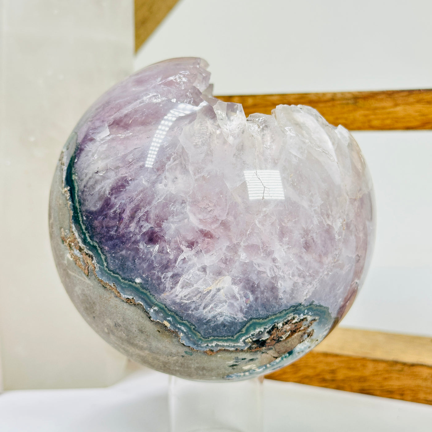 amethyst sphere with decorations in the background