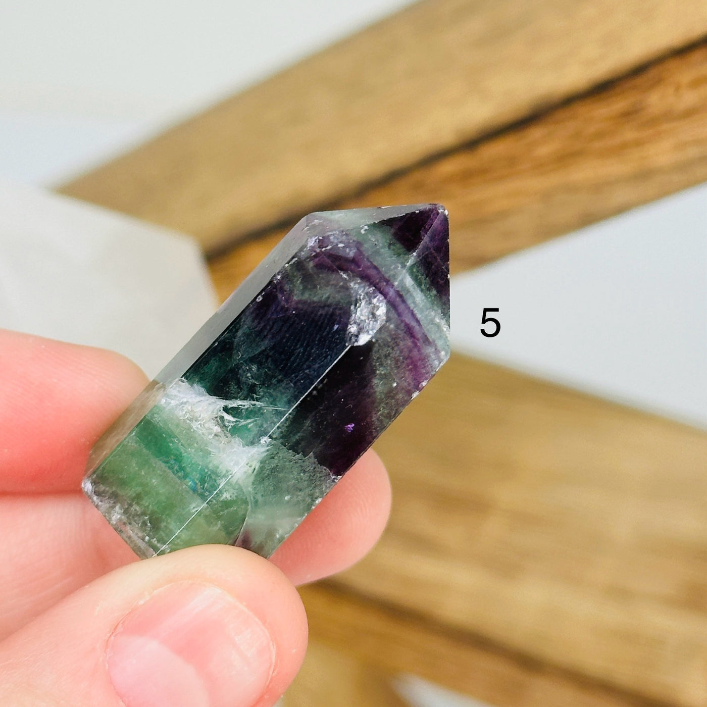 fluorite points with decorations in the background