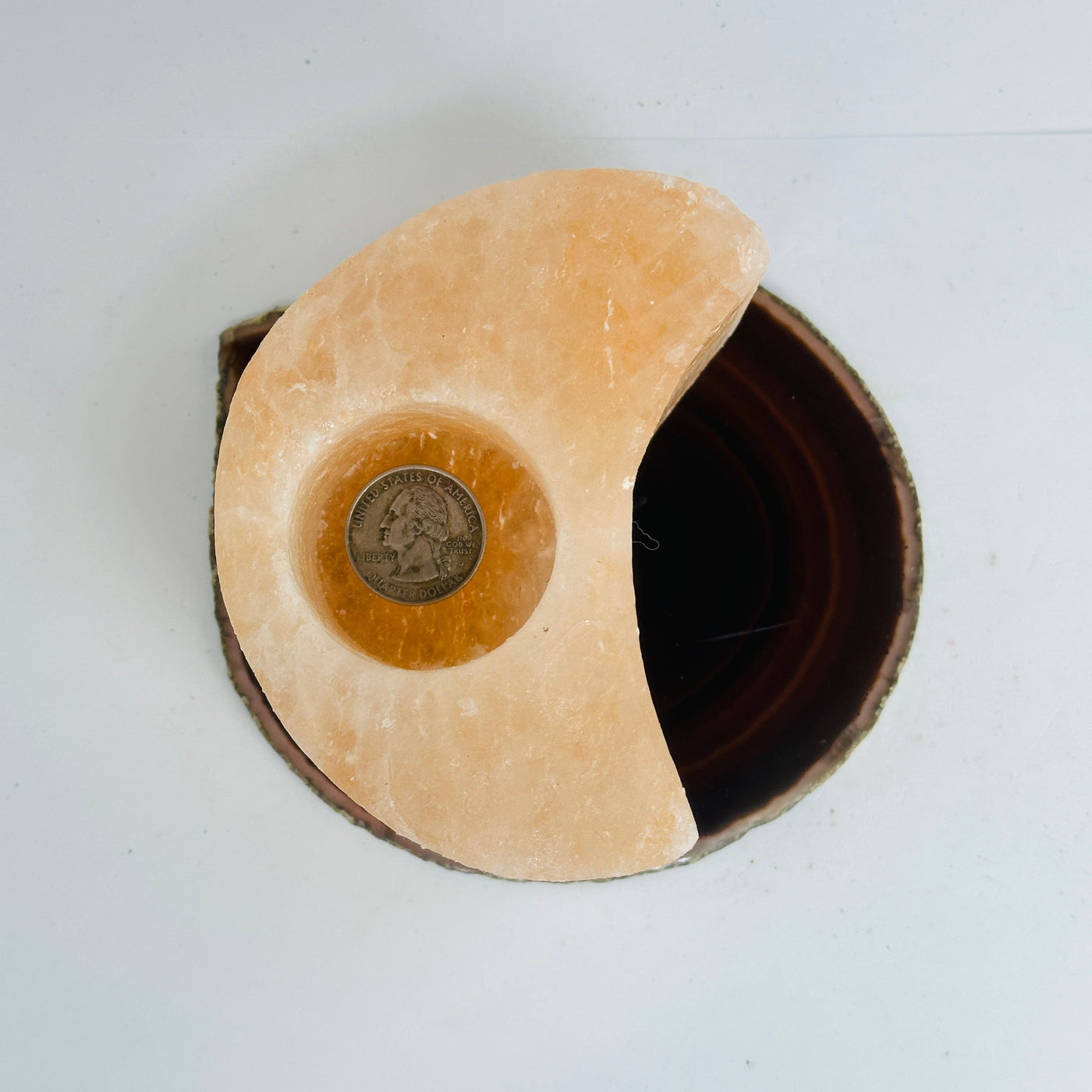 Himalayan Salt Orange Moon Candle Holder top view with quarter in hole for size reference