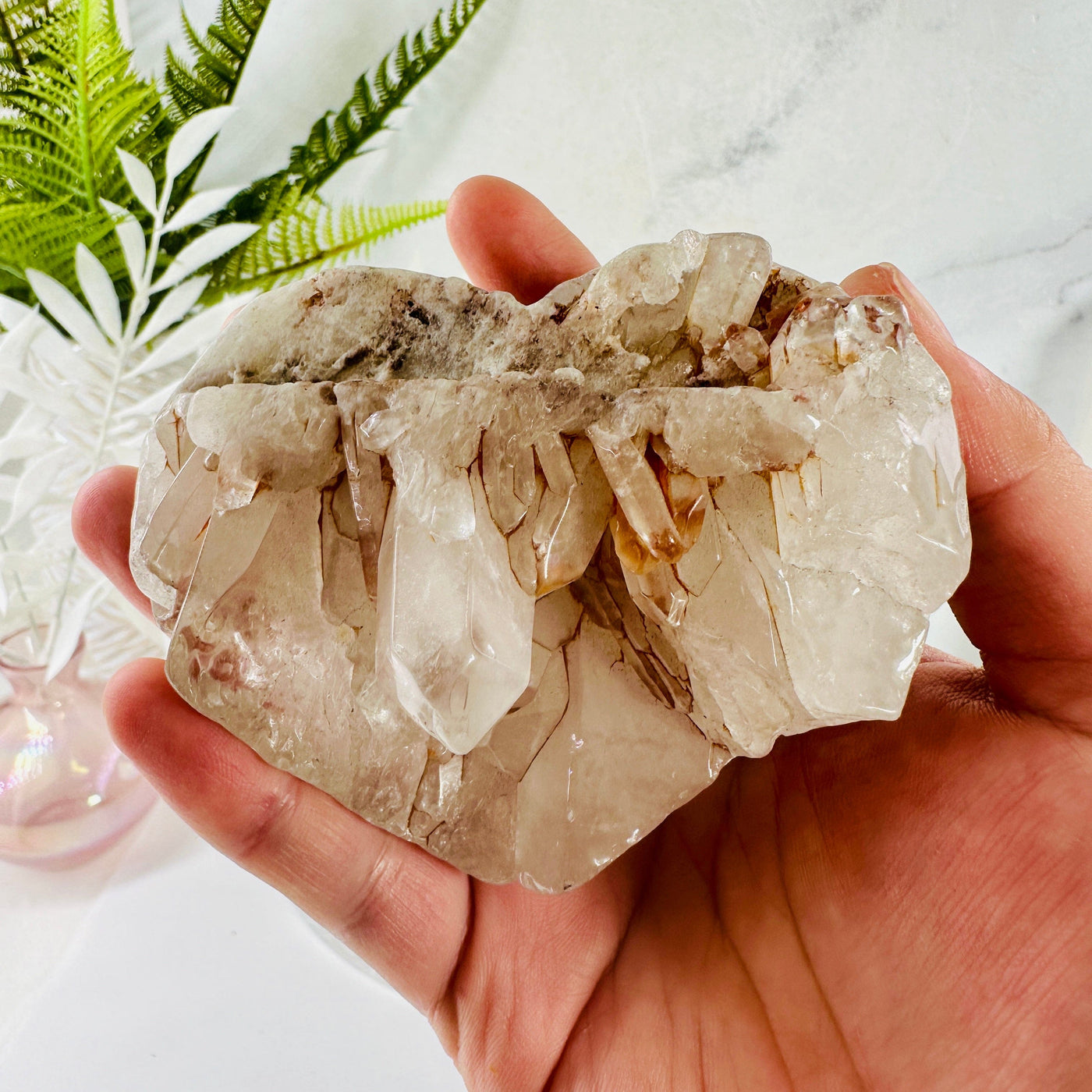 Crystal Quartz Cluster Heart in hand for size reference