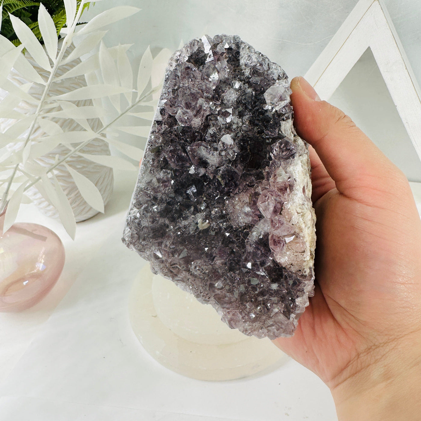 Amethyst Crystal Cluster - raw amethyst in hand for size reference