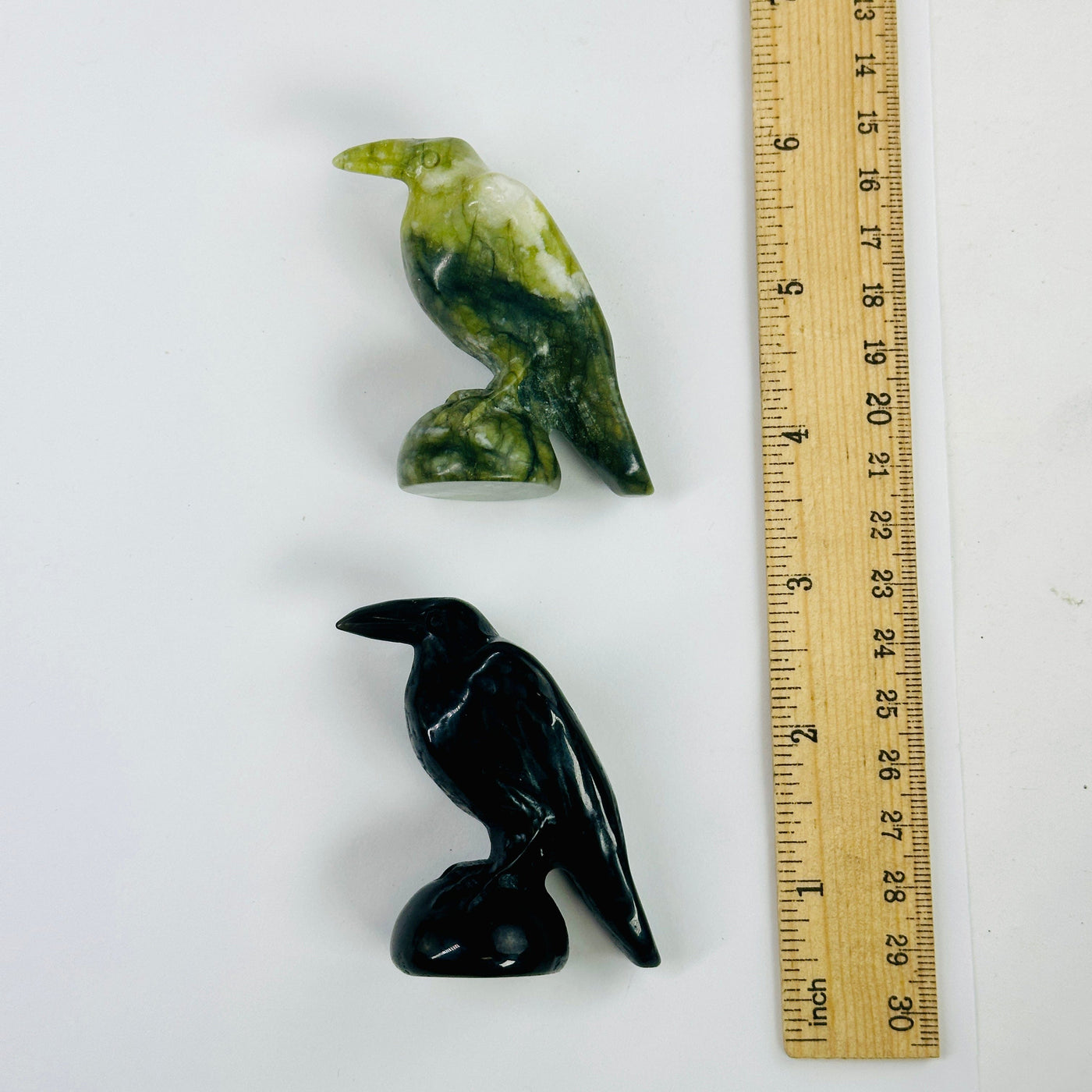 Gemstone Raven - Carved Raven - 1 green jadeite raven and 1 black obsidian raven next to ruler for size reference