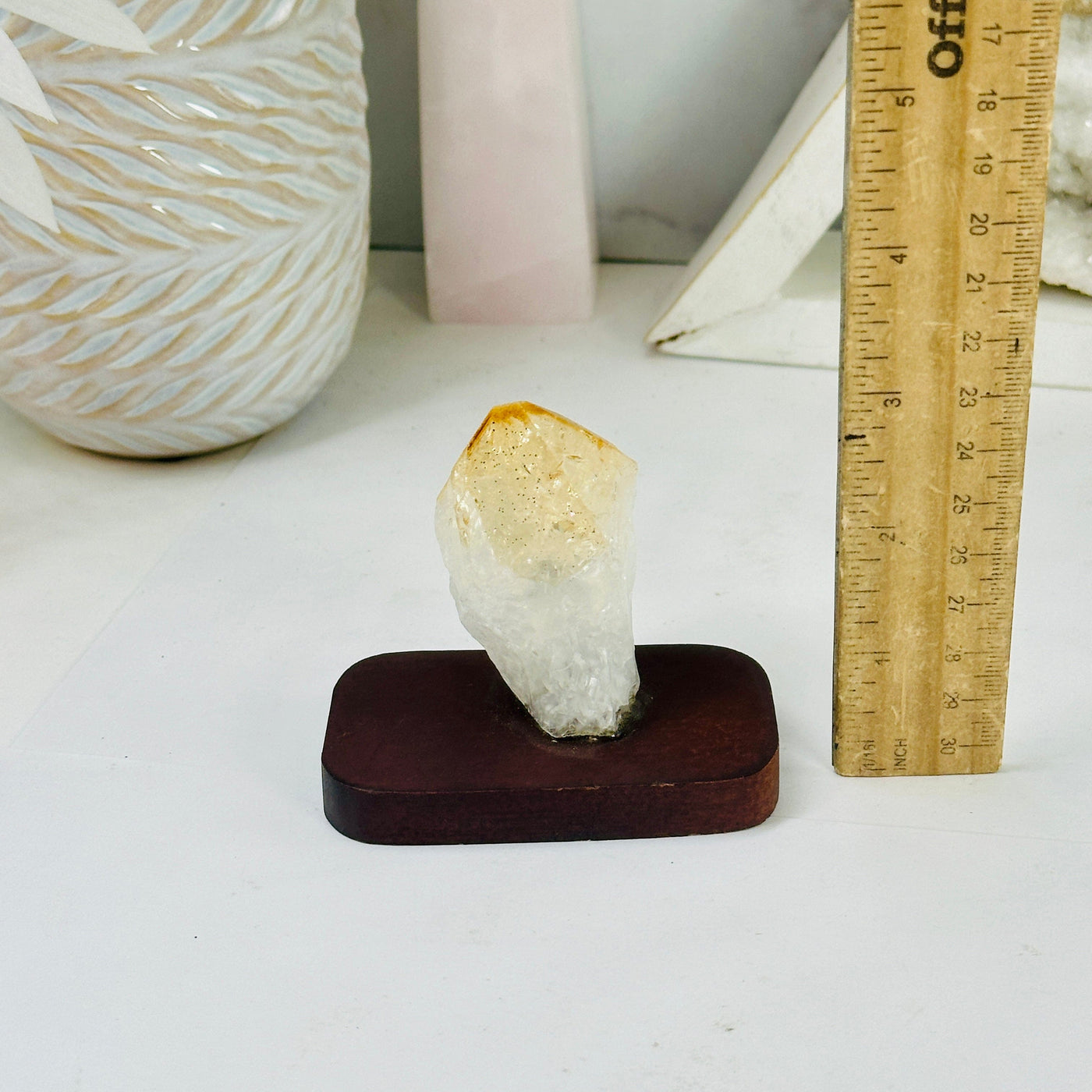 Citrine Point on Wooden Base with ruler for size reference