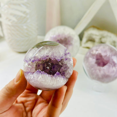 Amethyst Sphere - Crystal Ball - YOU CHOOSE variant A in hand for size reference