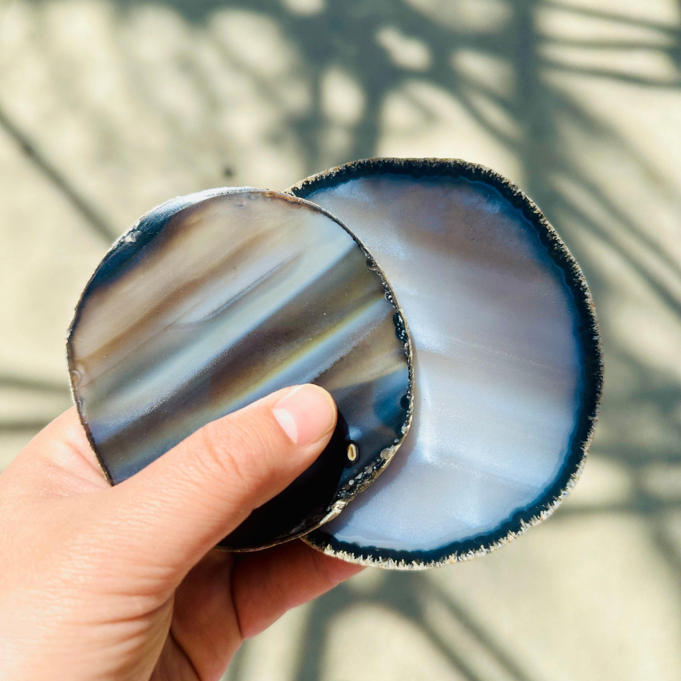  Agate Slice Set - Set of Two Agate Crystal Coasters in hand for size reference
