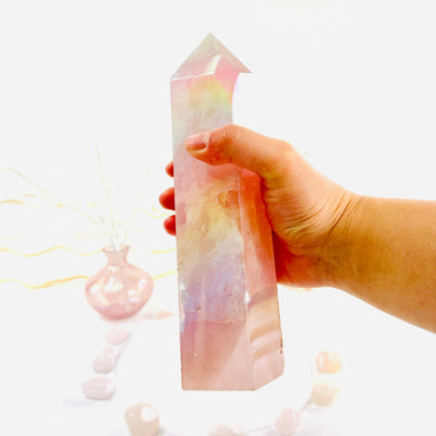 Angel Aura Rose Quartz Obelisk with Natural Inclusions in hand to show size reference