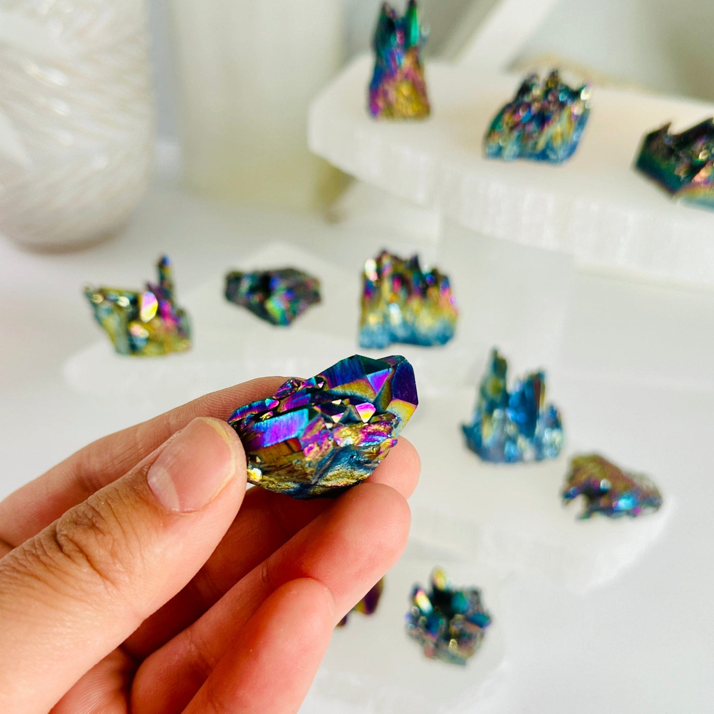 Rainbow Titanium Coated Amethyst Cluster - Small Crystal Cluster - You Choose variant 4 in hand with other variants in background for size reference