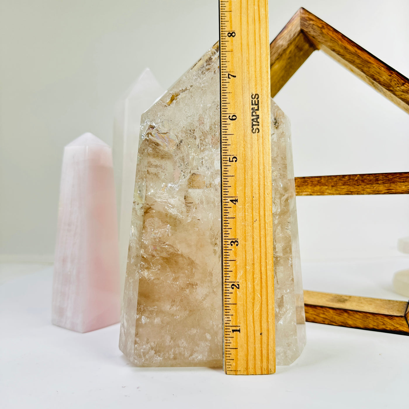 crystal quartz point next to a ruler for size reference