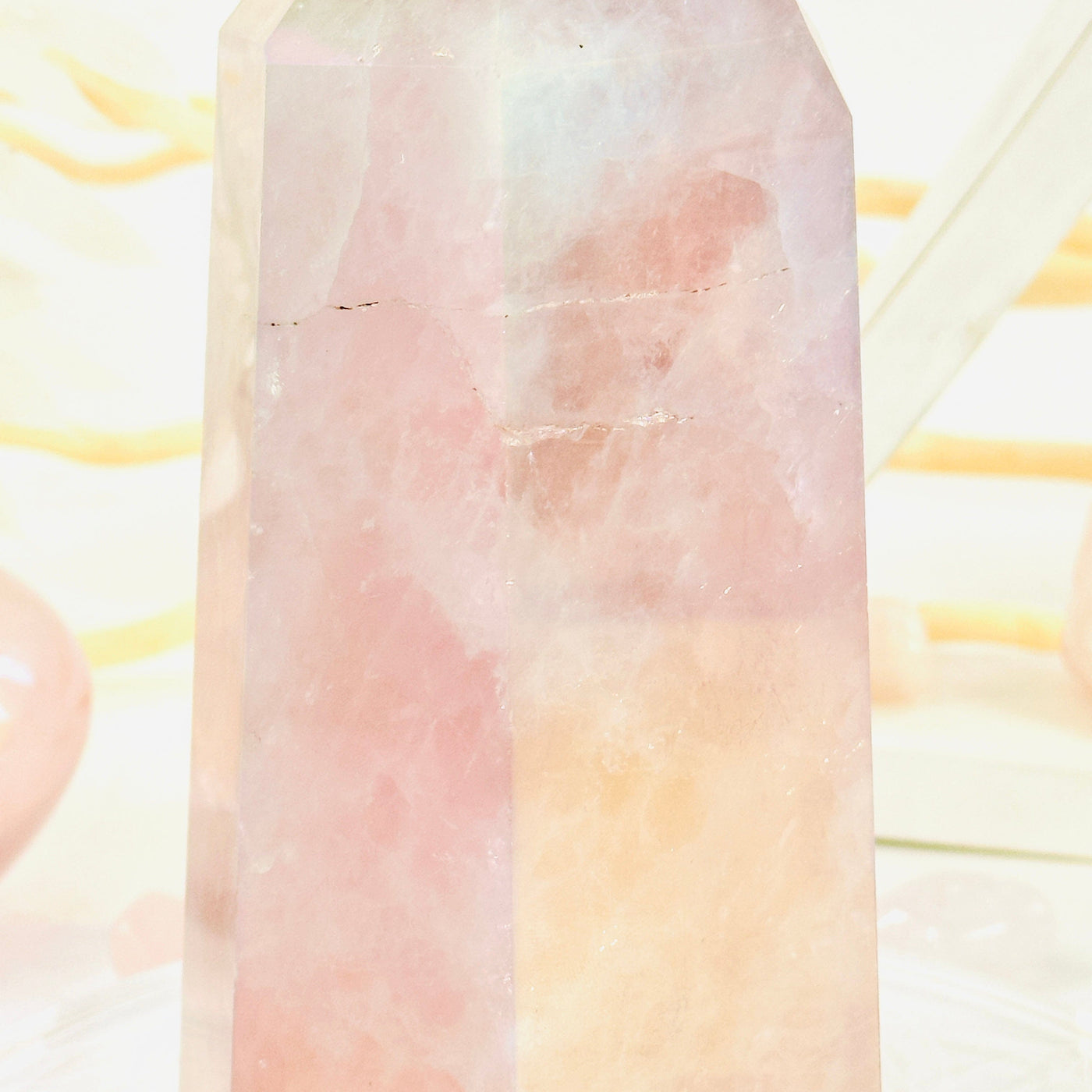 Angel Aura Rose Quartz Polished Point with Natural Inclusions closeup to show natural inclusions detail