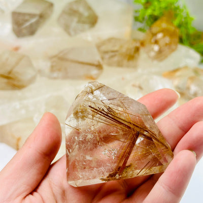 Rutilated Quartz - Polished Freeform Crystal - YOU CHOOSE variant 4 in hand for size reference with other variants in background