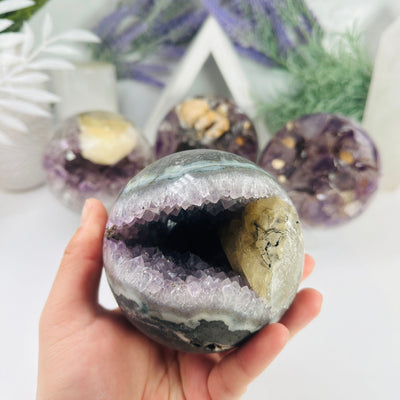 Amethyst Agate Crystal Sphere with Calcite - You Choose variant A in hand for size reference