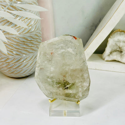 Polished Crystal Quartz Freeform with Inclusions on stand front view