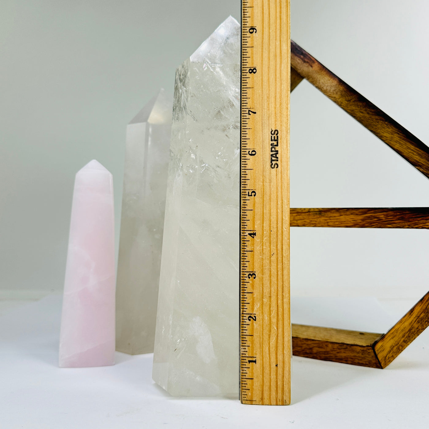 crystal quartz point next to a ruler for size reference