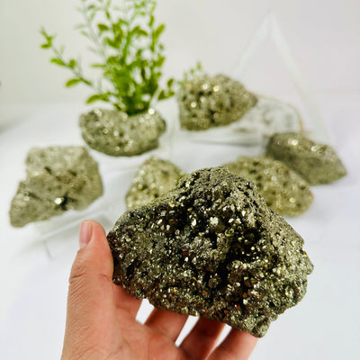 Pyrite - Rough Stones - You Choose variant in hand with other variants in background