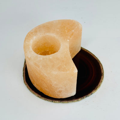 Himalayan Salt Orange Moon Candle Holder candleholder on agate slice side view