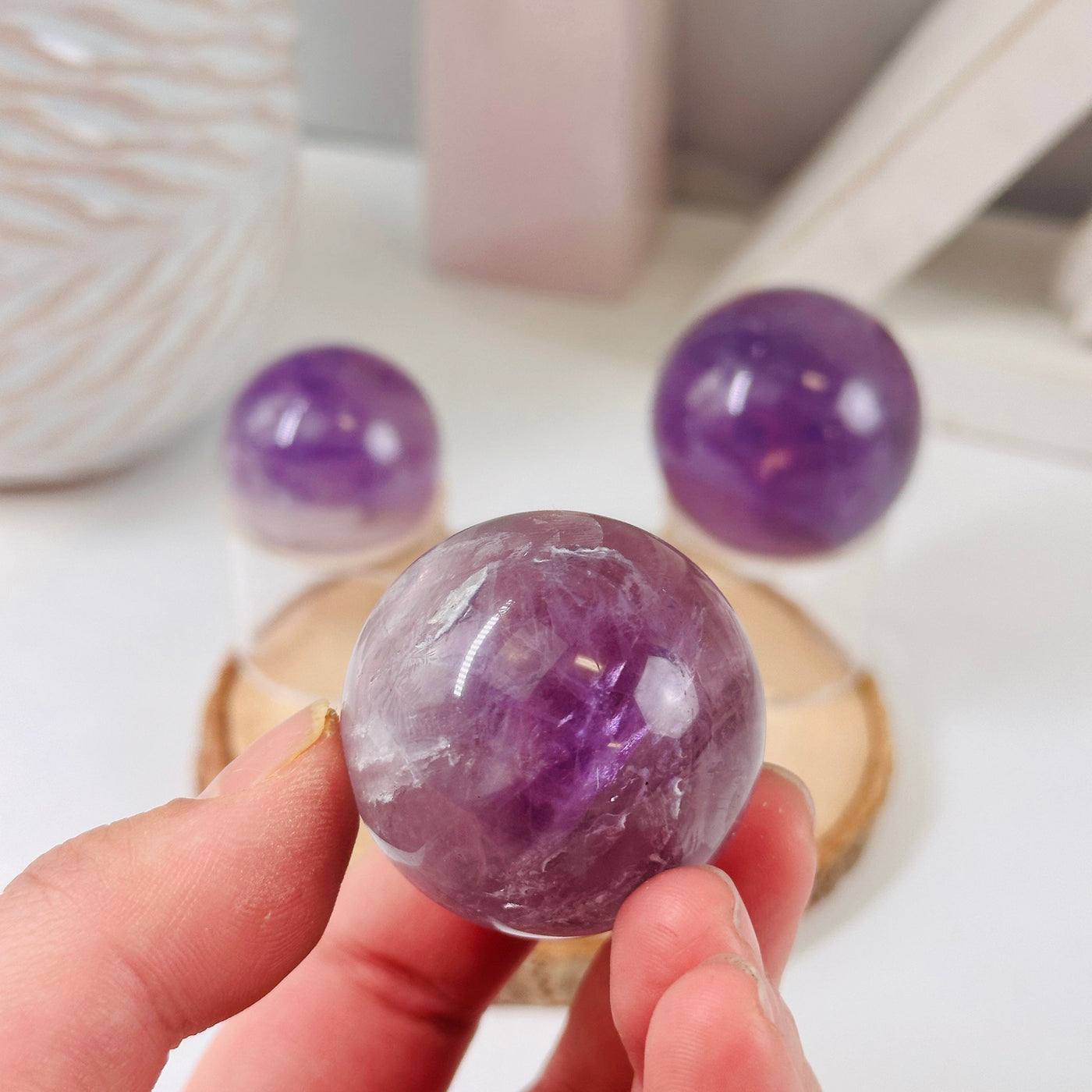 Amethyst Polished Sphere - Crystal Ball - YOU CHOOSE variant A in hand for size reference
