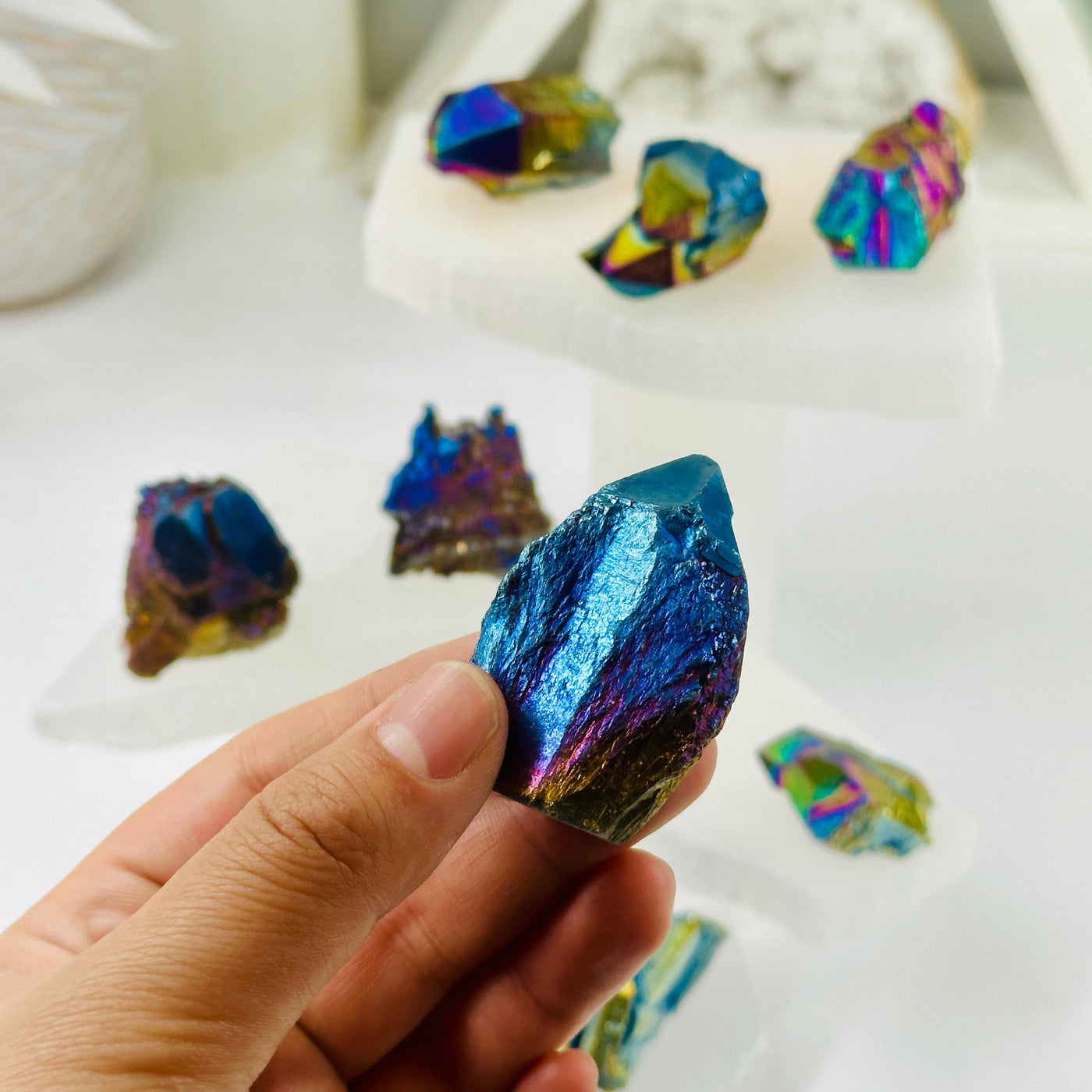 Rainbow Titanium Coated Amethyst Crystal Cluster - You Choose variant 4 in hand for size reference with other variants in background