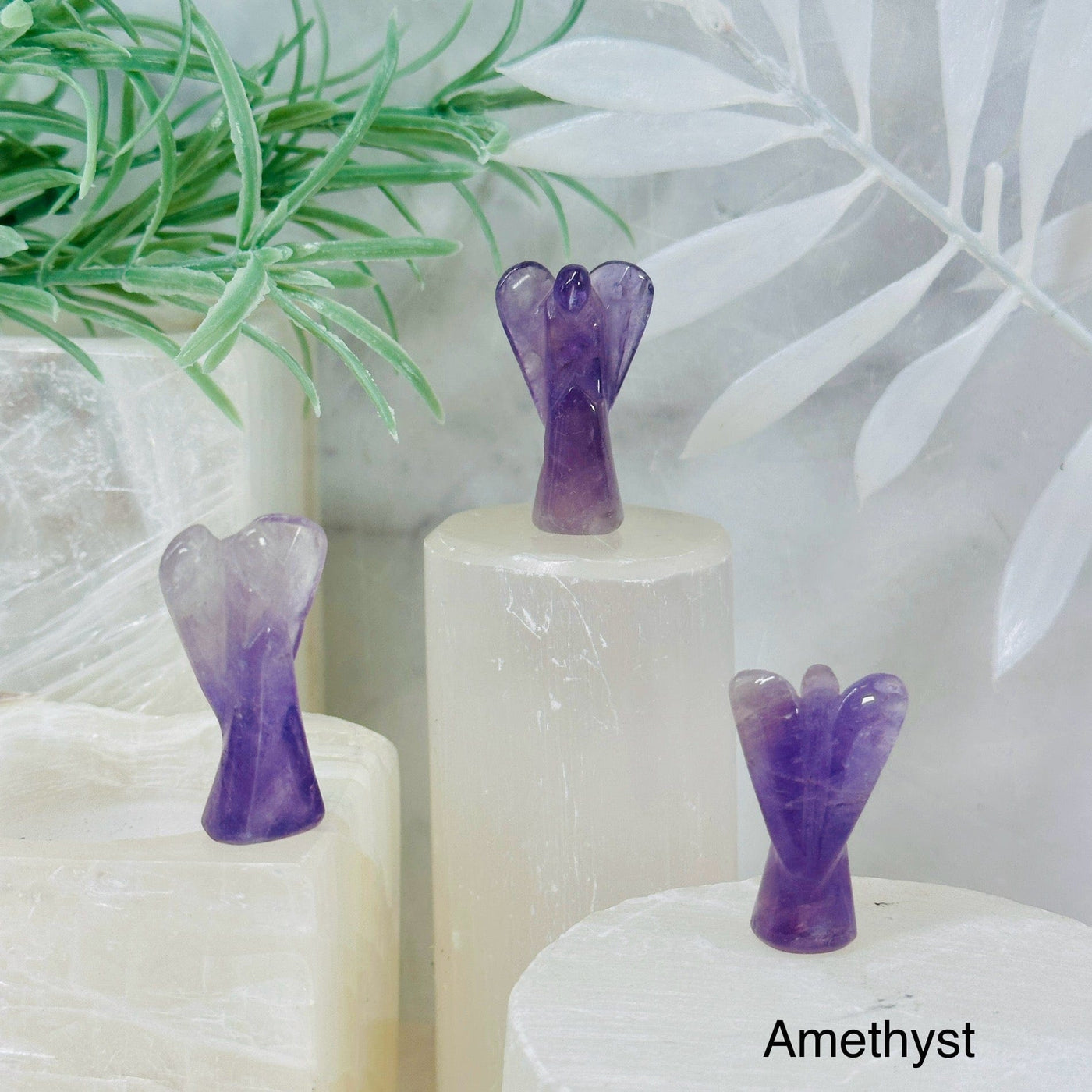 Gemstone Angels - Medium 3 amethyst angels on pedestals at different angles labeled