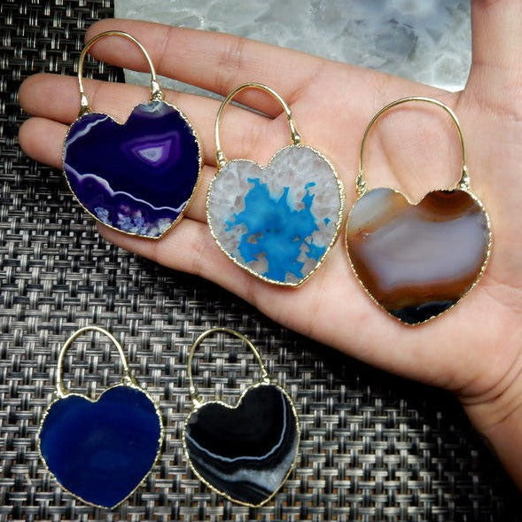 Agate Slice Heart Shaped Pendant with Electroplated Edge & Fancy Bail in a hand for size reference