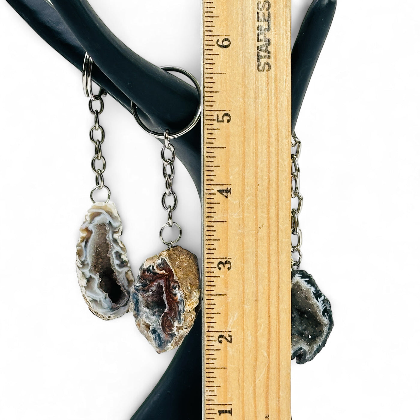 Three Agate Geode Keychain with a ruler for size reference.