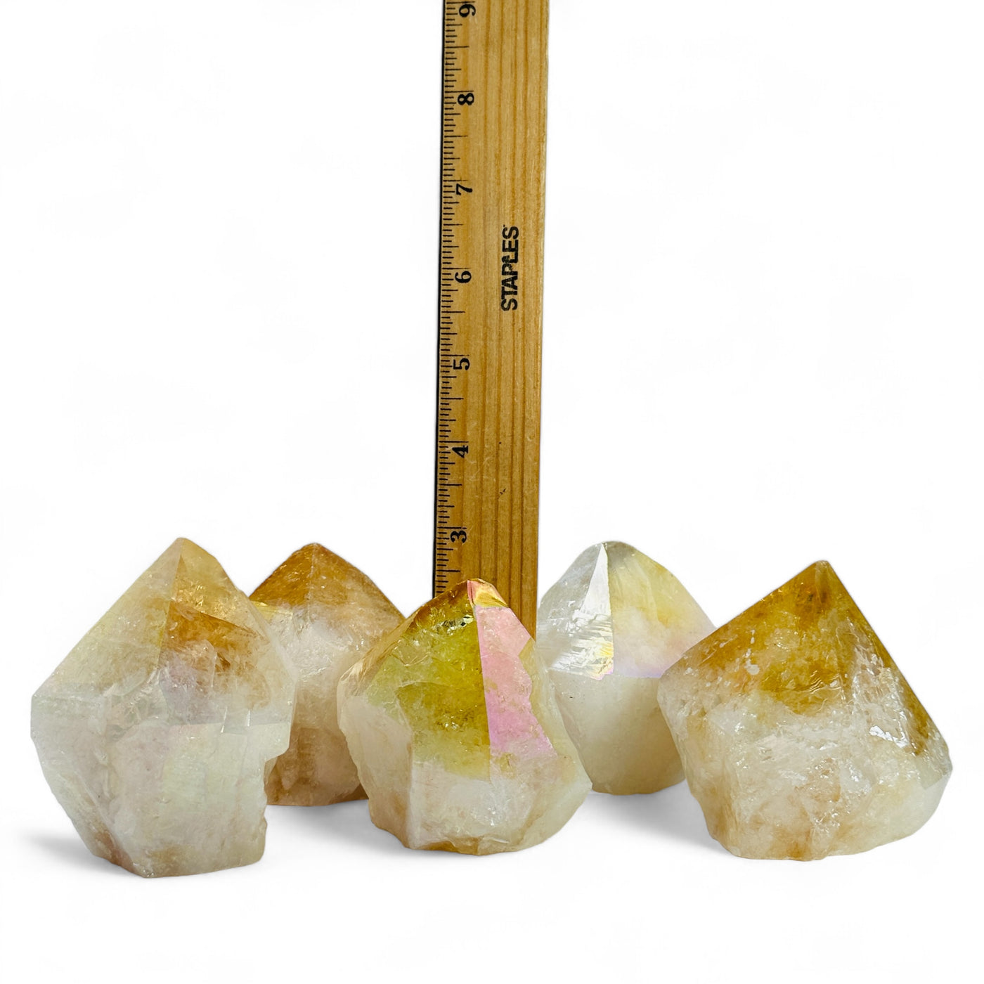 Angel Aura Citrine Crystal Points next to a ruler for size reference.