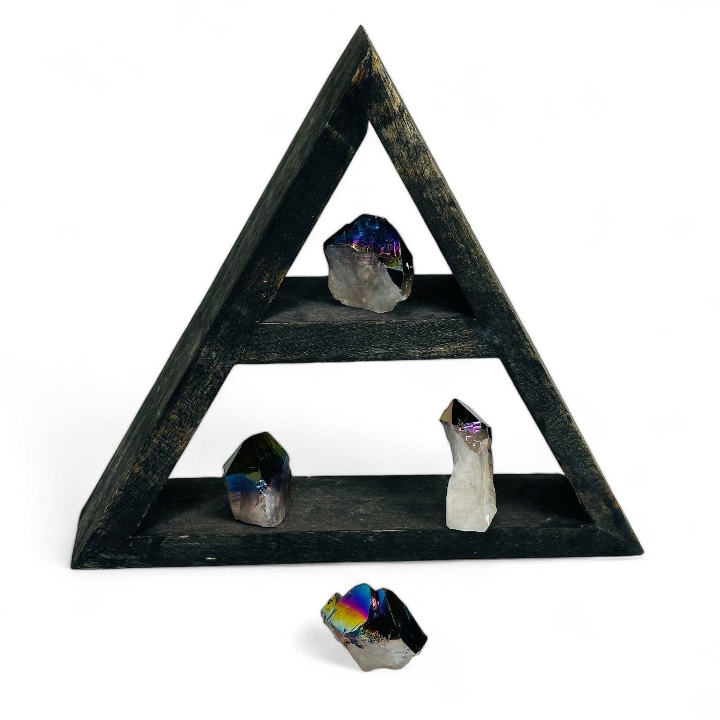 Rainbow Titanium Coated Crystal Quartz Points on a wood shelf with a white background.