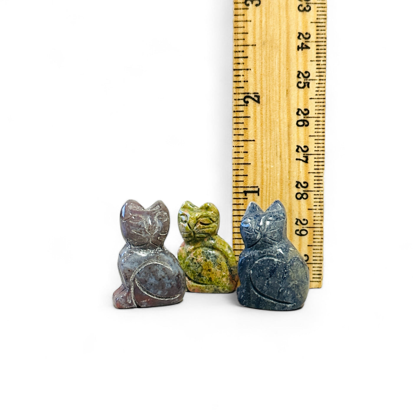 Gemstone Cat next to a ruler for size reference.