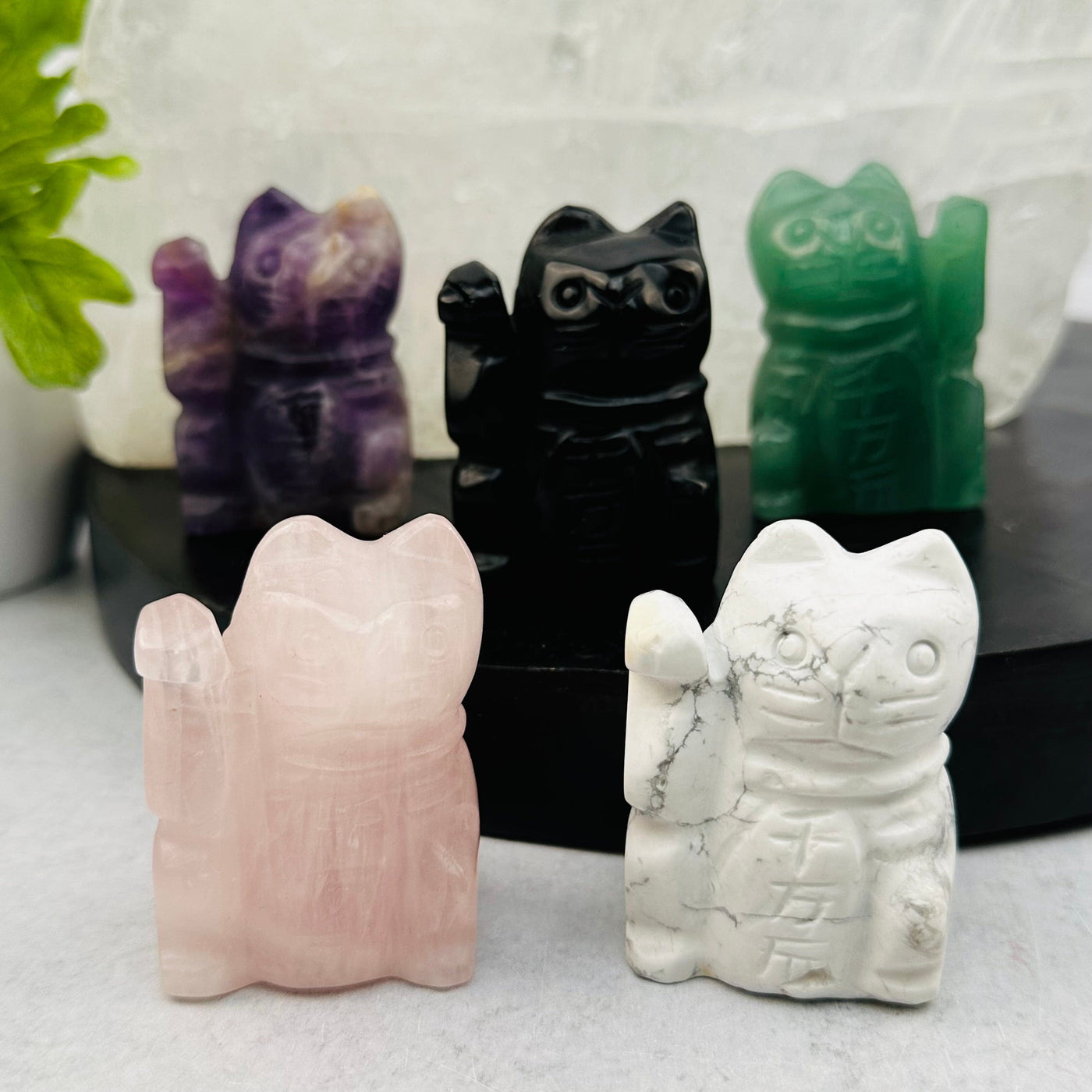 multiple lucky cats displayed to show the differences in the color shades