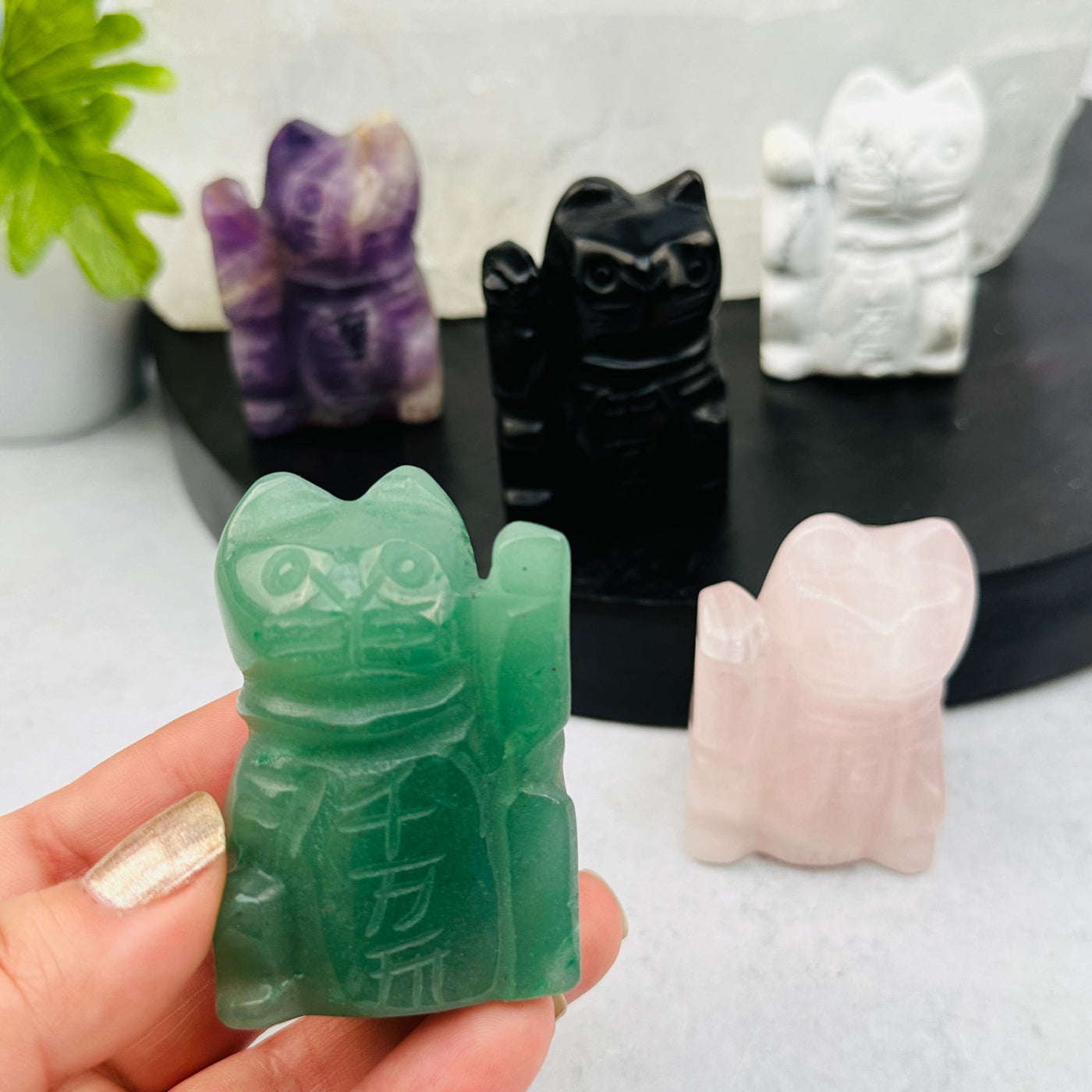 Lucky Crystal Cats displayed to show the differences in the crystal types and colors 