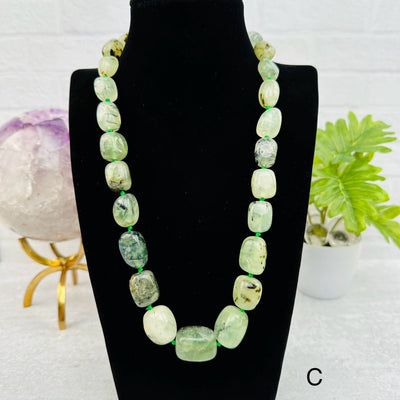 prehnite necklace displayed to show how it hangs