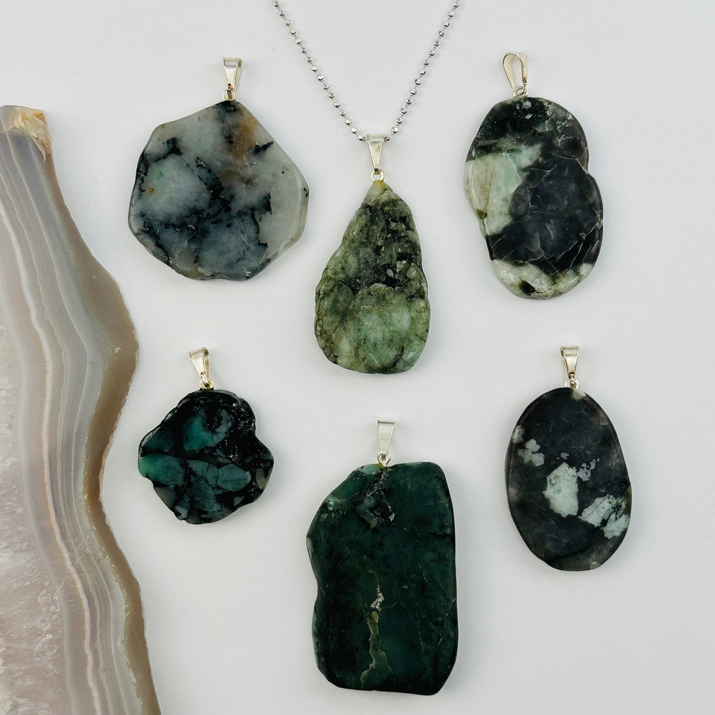 multiple pendants displayed to show the differences in the sizes and color shades 